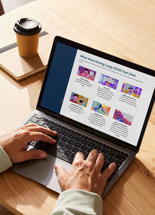 A photo of a person’s hands typing on a laptop. On the screen is the DOH Long COVID website. The header on the website reads, “What Does Having Long COVID feel like?” Below the text are illustrated images explaining common symptoms. 